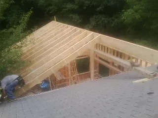 Framing a new roof addition that ties into an existing shingle roof in Honeoye