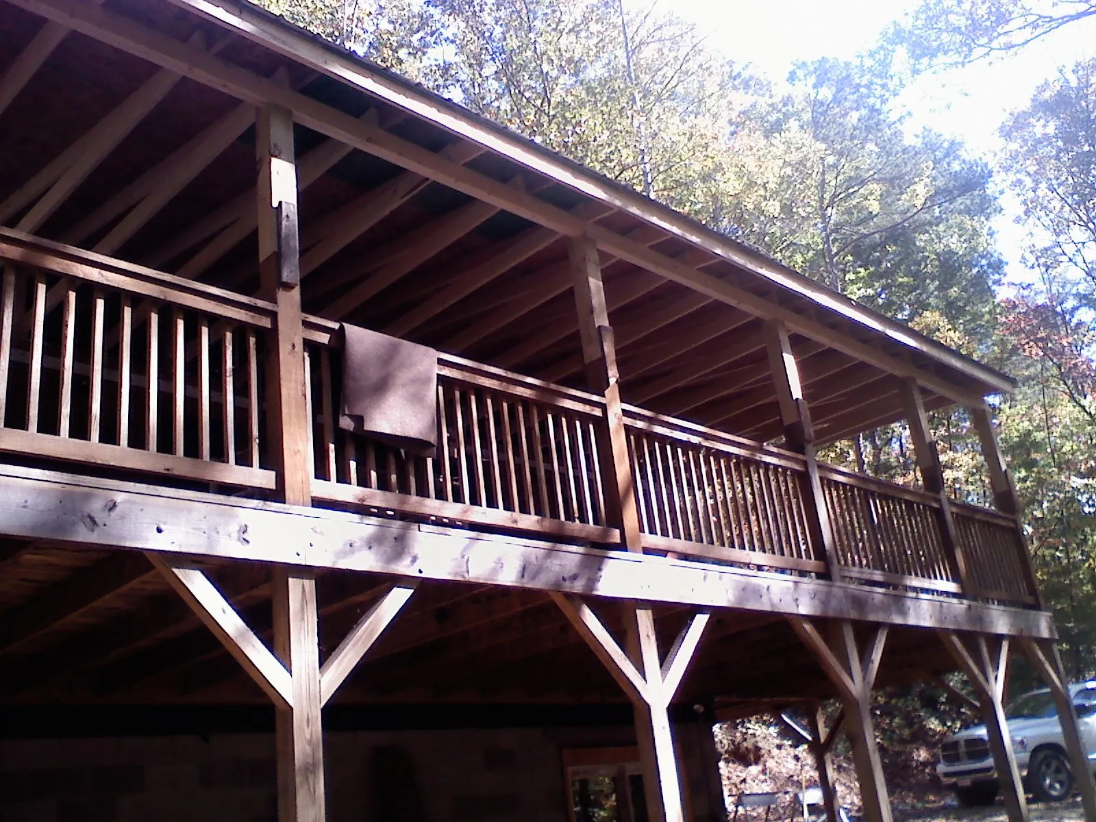 Timber framing under a new elevated porch and deck — Roof Leak Repair in Honeoye by Roofing Brothers